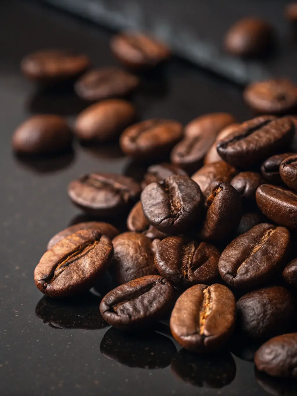 A close-up shot of freshly roasted coffee beans, showcasing their rich, dark color and oily sheen, piled high in a burlap sack, symbolizing the robust flavors of our dark roast coffees.